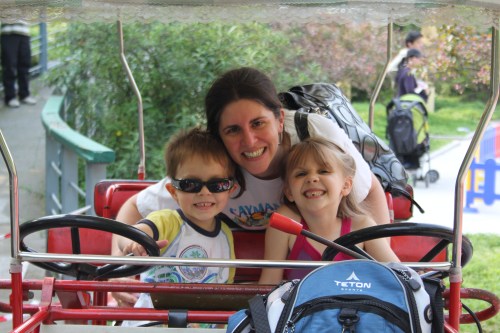 Isabelle and Oliver attempting to ride the bike themselves Isabelle and Oliver attempting to ride the bike themselves