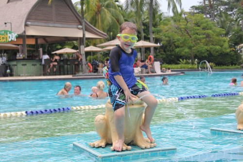 Oliver chilling with the frogs by the pool