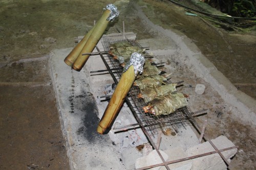 Chicken in the bamboo and fish wrapped in leaves.