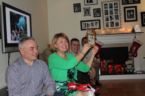 Jane winning Michael Fish fridge magnets in our Annual "Dirty Santa" game.