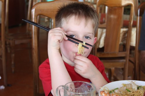 Oliver is getting used to chopsticks and is getting quite good with them!