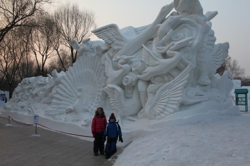 Isabelle and Oliver by a sculpture