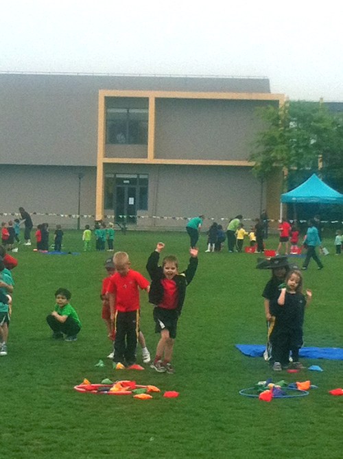 Throwing the bean bags in the hoop (point for each).  Oliver is delighted with his efforts!