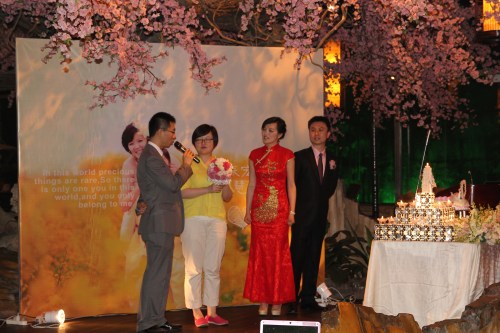 Monica receiving the brides bouquet.