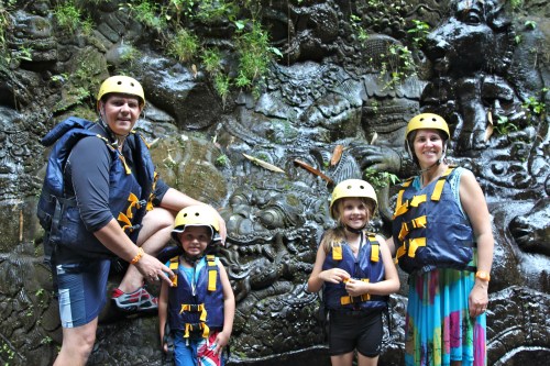 Posing by a part of the stone carving.