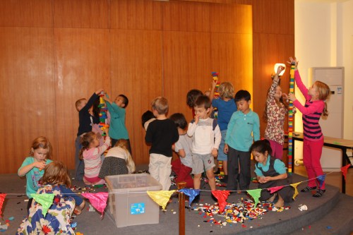 Scrambling for the Lego to build the towers!