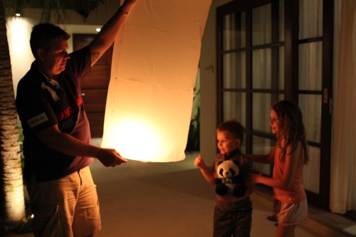 Isabelle and Oliver watching Daddy make sure that the Chinese Lantern is full before letting go.