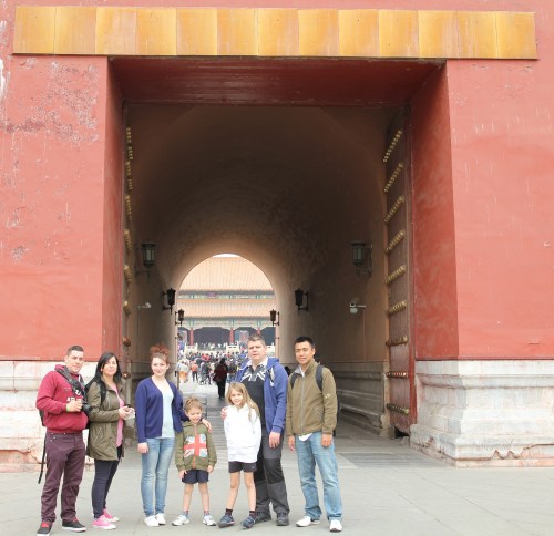 Standing by 1 of the main entrances into the Forbidden City.  The red doors are huge and very thick.